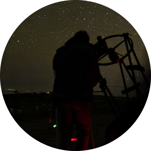 Multicultural night sky tours with laser pointer and telescope